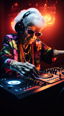 Obraz na płótnie Canvas Bright elderly woman DJ at a rave. Techno party in the club. Grandma DJ.