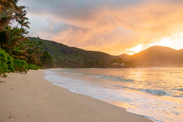 picturesque bright sunset landscape beach in Seychelles, nanure background