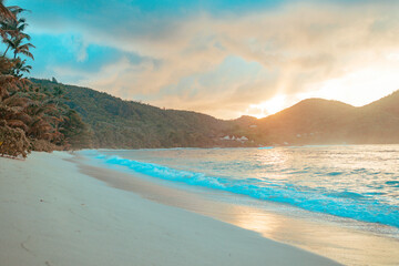 picturesque bright sunset landscape beach in Seychelles, nanure background