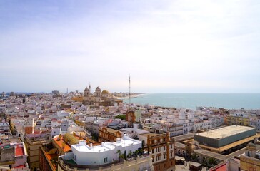 Naklejka premium View from the observation tower Torre Tavira in Cadiz over the city with a view of the Cathedral of Cadiz and the Atlantic Ocean, Catedral de la Santa Cruz de Cádiz, Andalusia, Spain