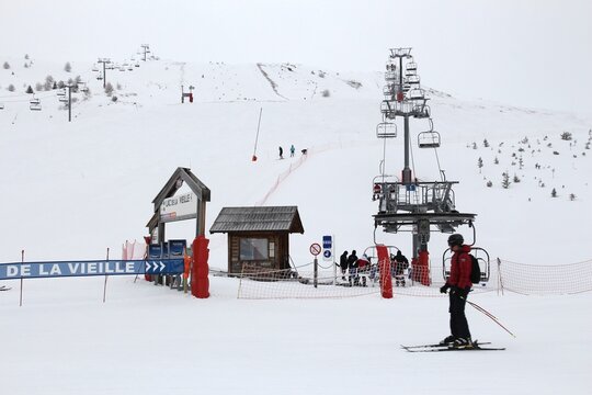 VALLOIRE, FRANCE - MARCH 27, 2015: Skiers go up the lift in Galibier-Thabor station in France. The station is located in Valmeinier and Valloire and has 150km of ski runs.