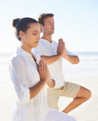 Yoga, meditation and travel with couple on beach together for wellness, zen or holistic exercise. Summer, awareness or mindfulness with young man and woman by sea or ocean for balance and inner peace