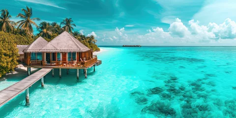 Keuken foto achterwand Turquoise Tropical Resort Paradise with Overwater Bungalows, copy space for banner. Panoramic view of luxury overwater summer bungalows with thatched roofs in a tropical island resort, serene blue ocean water.