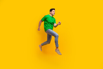 Full length photo of optimistic pleasant man dressed green t-shirt look at sale empty space running...