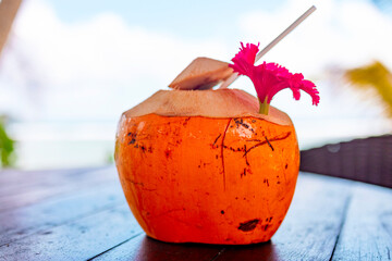 coconut in sunglasses on table on the background of the sea, the concept of summer holidays and...