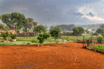africa rainy season in the village torrential rain view from the yard, village inn botswana