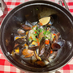 A pot with freshly cooked mussels - 710658070