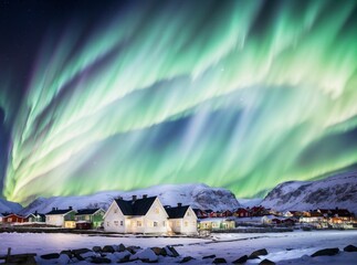 Beautiful landscape with white house at night - Northern lights or Aurora borealis in the sky -Tromso, Norway