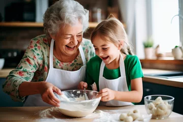 Fotobehang Taste of Tradition: In a Rustic Kitchen, a Grandmother and Child Cook Together, Sharing Love, Connection, and Happiness through the Art of Pastry. © Mr. Bolota