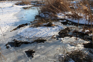 A river with snow on the banks