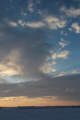 A cloudy sky over a body of water