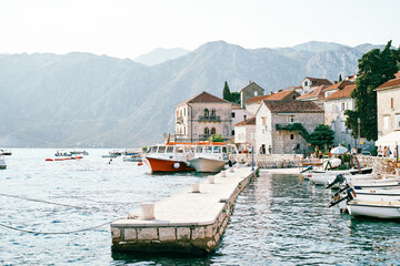 Pier with moored rows of boats. Perast, Montenegro