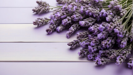 Lavender flower arrangement on a light wooden background with copy space. Flat lay