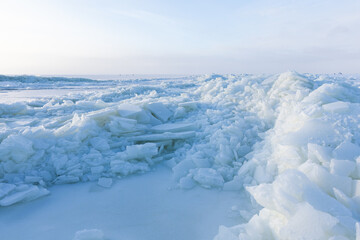 Winter landscape photo. Ice hummocks covered with snow
