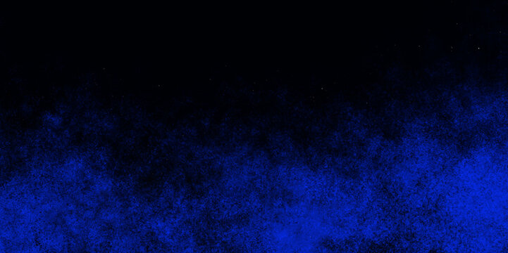 Blue color dust particles explosion cloud on black background. Blue paint spray texture. Watercolor wallpaper.