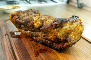 baked pork belly on a wooden board. food concept. diet. meat