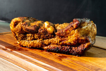 baked pork belly on a wooden board. food concept. diet. meat