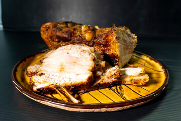 baked pork belly on a wooden board. food concept. diet. meat