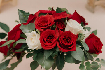 A bouquet of red roses and white roses