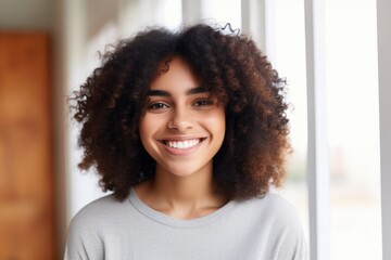 Black History Month, Portrait of beautiful young dark-skinned woman with shaggy hairstyle smiling showing white teeth