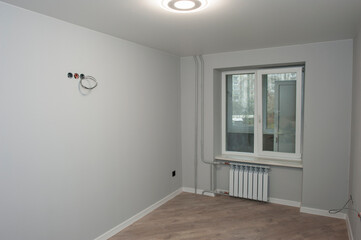 room after renovation, laminate and clean walls, restrained color of modern style and design