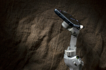Close-up of steadicam with phone for video or live broadcast. Indoor studio shot isolated on...