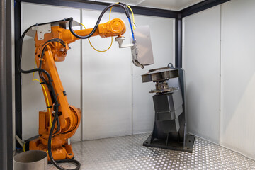 Industrial robot automation arm doing metal welding. Robotic machine arm in factory. Modern...
