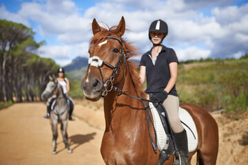 Fototapeta premium Woman, horse and countryside for horseback riding in texas, rider and sport training for performance. Farm, rural and nature in outdoor, adventure and animal in gravel, pet care and dirt road
