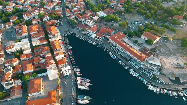 Aerial view of promenade in downtown with red rooftops in Foca, near Izmir, Turkiye