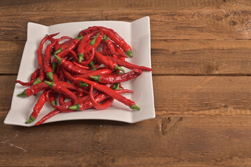 bitter red pepper in a white plate close-up