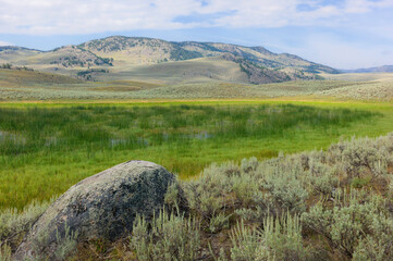 Yellowstone National Park with foothills and valley of sagebrush. Wyoming, USA.