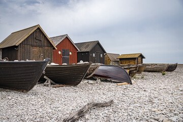 Old fishing station with wooden huts and old boats, Gotland, Sweden - obrazy, fototapety, plakaty