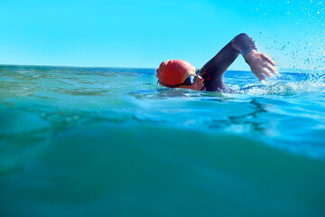 Swimming, crawl and person in ocean water in summer for exercise, training or workout on mockup...