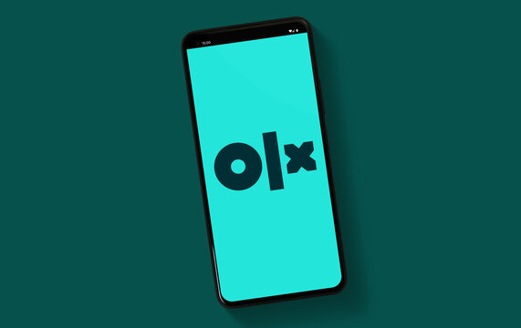 OLX company logo on mobile phone screen isolated on clean background - Warsaw, Poland - 16.01.2024