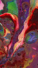 Paint bubbles. Oil fluid. Defocused purple yellow red color foam texture liquid ink water emulsion dissolving mix flow motion abstract art background.