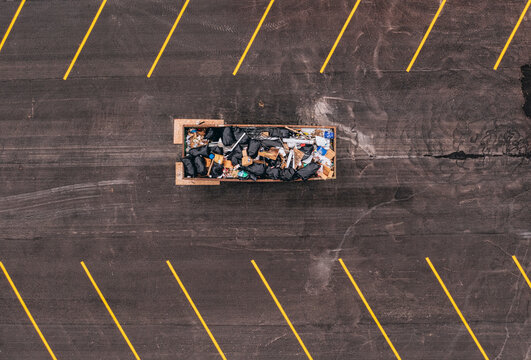 Aerial view of a dumpster bin in a parking lot, Vero Beach, Florida, United States.