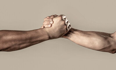 Two hands, helping arm of a friend, teamwork. Friendly handshake, friends greeting, teamwork