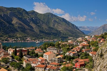 Fototapeta na wymiar The historic town of Kotor, Montenegro, unfolds along the shores of the Adriatic, embraced by dramatic mountains and the tranquil bay.