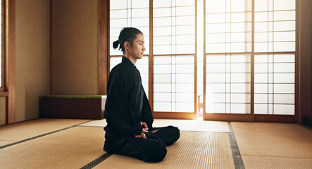 Martial arts man, meditation and exercise in Japanese dojo with mindfulness, zen or chakra balance...
