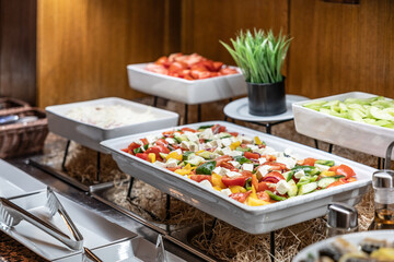 Catering meals prepared for guests at a wedding or hotel dinner. Healthy salads and other vegetables.