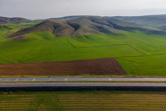 Aerial view of an empty highway along the hills in Central Anatolia region, Ankara, Turkey.