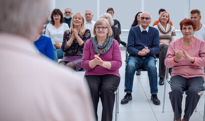 Old people in the seminar event. Many elderly in the conference