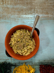 malloreddus or Sardinian gnocchetti, typical Sardinian pasta, basil and pecorino cheese.