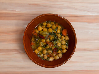 Chickpea soup, cherry tomatoes and rocket, vegetarian food.