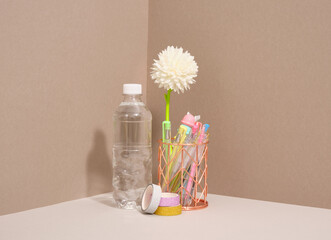 Water bottle, stationery and colored tapes on the table. Office supplies set.