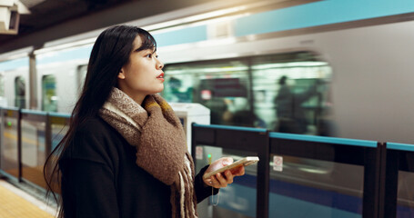 Japanese woman, phone and train station for travel with app, waiting and happy for metro...