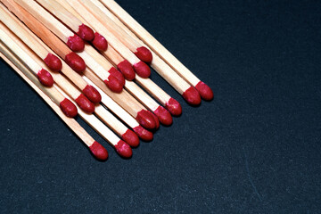 stacked matches lying on a table