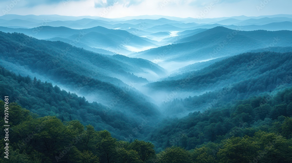 Aufkleber a view of a mountain range with a foggy valley in the foreground and trees in the foreground.