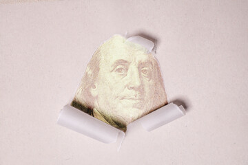 Torn paper with Portrait of Benjamin Franklin