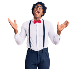 Handsome african american man with afro hair wearing hipster elegant look celebrating mad and crazy for success with arms raised and closed eyes screaming excited. winner concept